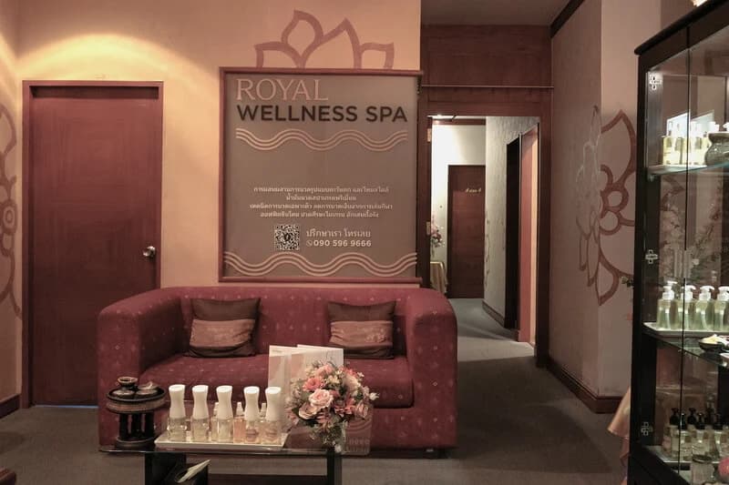Royal Wellness Spa reception with burgundy seating