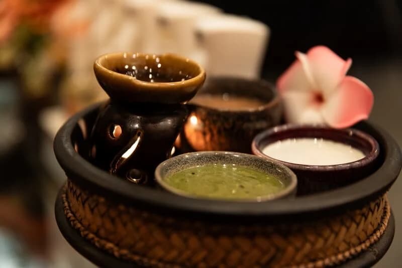 Small treatment bowls on a decorative tray at Royal Wellness Spa